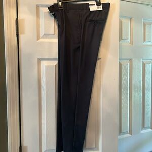Never worn, IZOD charcoal boys dress pants with tag.